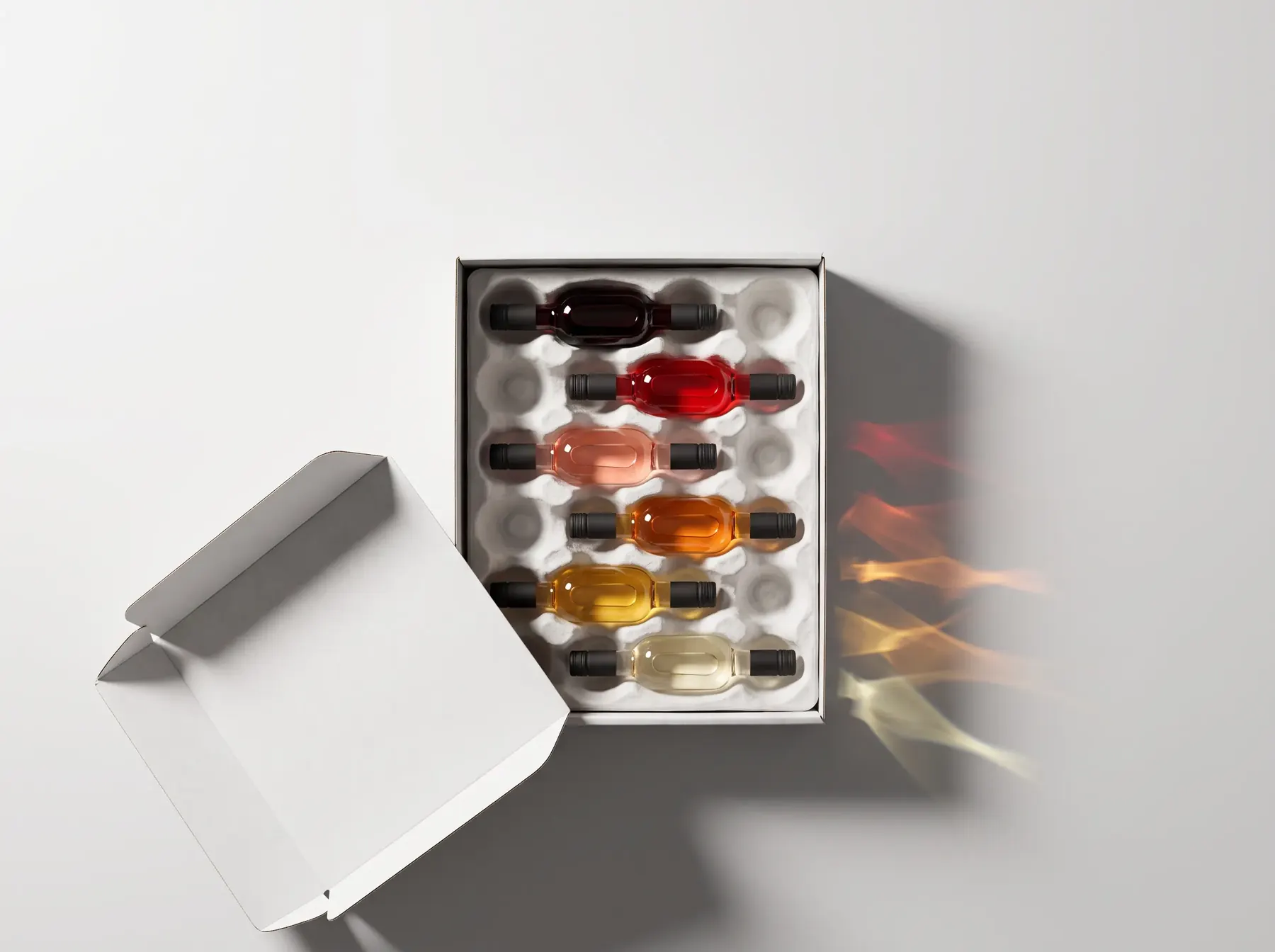 An open shipping box holding six mini bottles in a paper insert